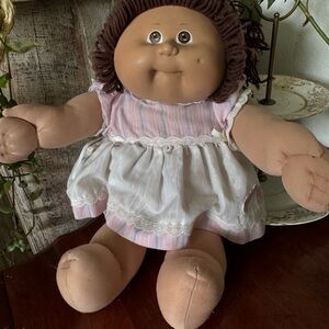 Adorable Brown-Haired Doll in Pink Dress